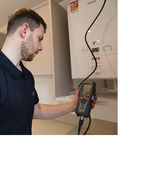 Gas Safe Registered engineer servicing a boiler